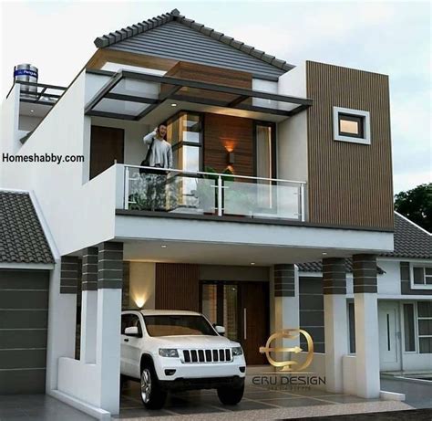 A White Truck Is Parked In Front Of A Two Story House With Balconies