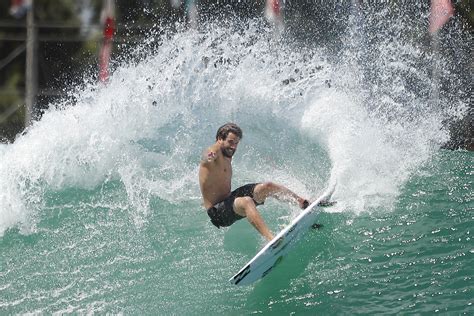 Olympic surfing: Can the exclusive sport become accessible? | AP News