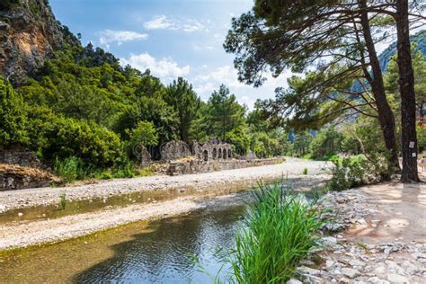 Olympos Ancient Ruin Site View In Popular Resort Town Of Olympos Near