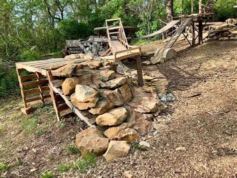 A Pile Of Rocks Sitting Next To A Wooden Bench