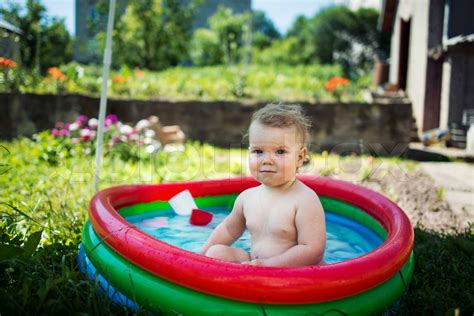 Little girl swimming in pool | Stock image | Colourbox