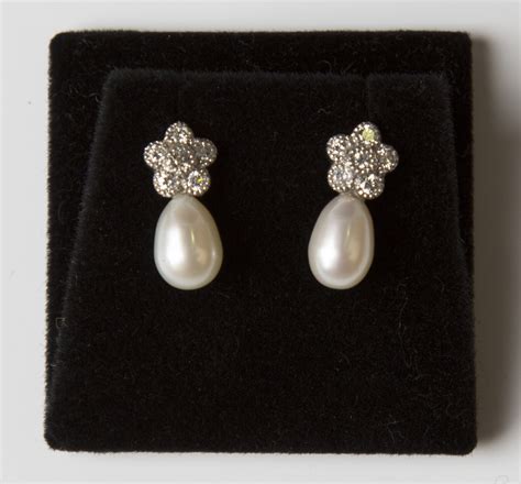 A Pair Of 18ct White Gold Cultured Pearl And Diamond Earrings Each Mounted With A Pear Shaped Cult