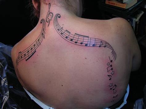 Music Notes Tattoo Designs On The Girl's Body