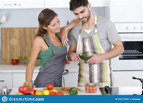 Beautiful Young Couple Preparing Healthy Meal Together Stock Image