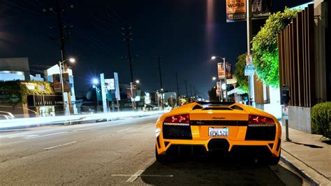 Orange Sports Car Parked On Side Of Road Hd Wallpaper Wallpaper Flare