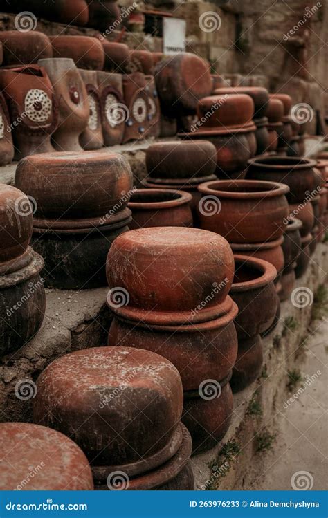 Stacks Of Handmade Ceramic Red Clay Brick Pots For Plants In A