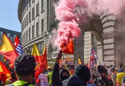 Protester Holds Smoke Flare During Demonstration Editorial Stock Photo