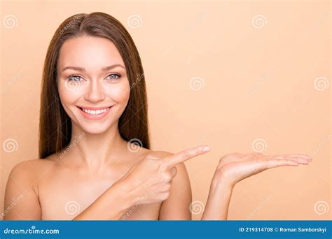 Portrait Of Pretty Nude Cheerful Girl Holding On Palm Demonstrating