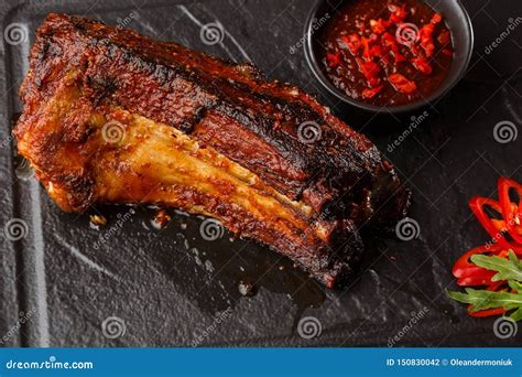 Grilled And Barbecue Hot Pork Ribs With Hot Chilli Pepper And Hot Sauce