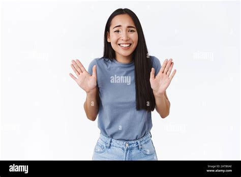 Smiling Cute Asian Girl Feeling Awkward To Refuse Friend Raising Hands Up In Surrender Or