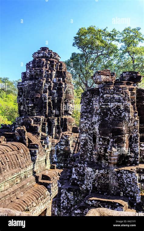 Giant Stone Faces Of Ancient Buddhist Khmer Bayon Temple In Angkor Thom