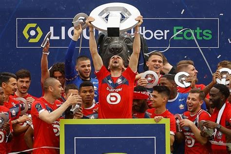 lille players celebrate trophy  winning editorial stock photo