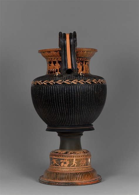 An Antique Vase With Decorative Designs On It