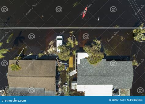 Kayak Boat Floating On Flooded Street Surrounded By Hurricane Ian