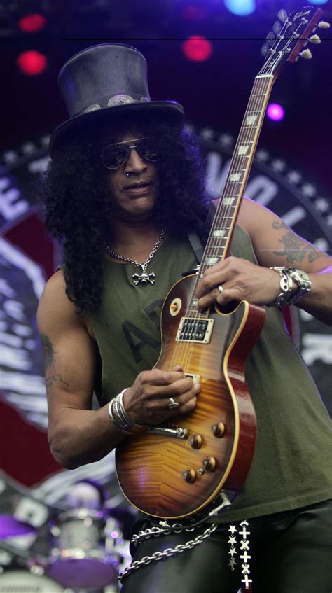 SLASH TATTOOS PICTURES IMAGES PICS PHOTOS OF HIS TATTOOS