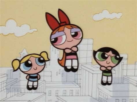 The Powerpuff Girls Are Flying Through The Air In Front Of Some Tall