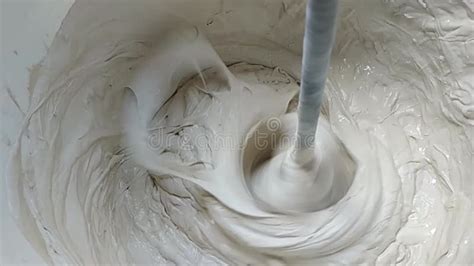 Mixing Gypsum Putty Or White Plaster Using A Electric Construction