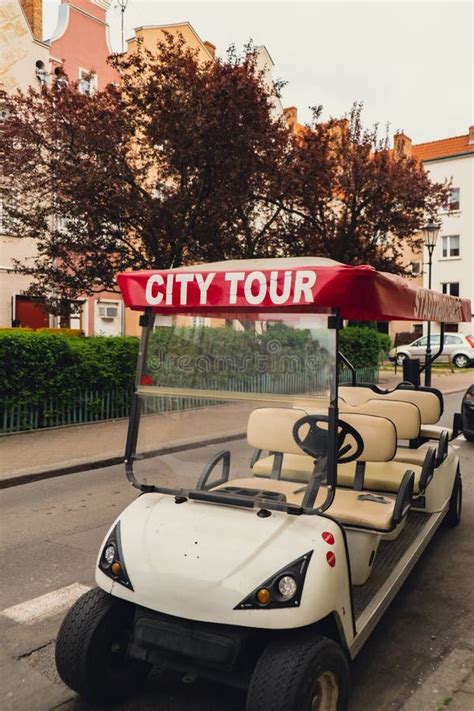 Red City Tour Car In The Old City With Text Sign Of Sightseeing City