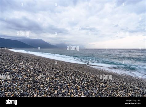 Beautiful Scenic Of Ocean With Sprawling Stone Covered Beach