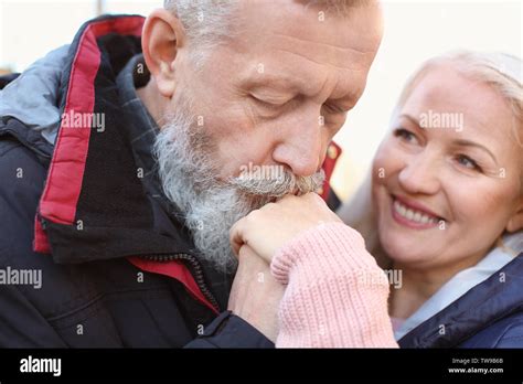 Mature Man Kissing His Wife S Hand Outdoors Closeup Stock Photo Alamy