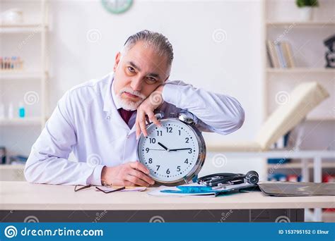 Old Male Doctor Working In The Clinic Stock Photo Image Of Disease