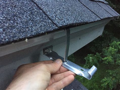 How to install gutter hanger straps underneath asphalt shingles : r