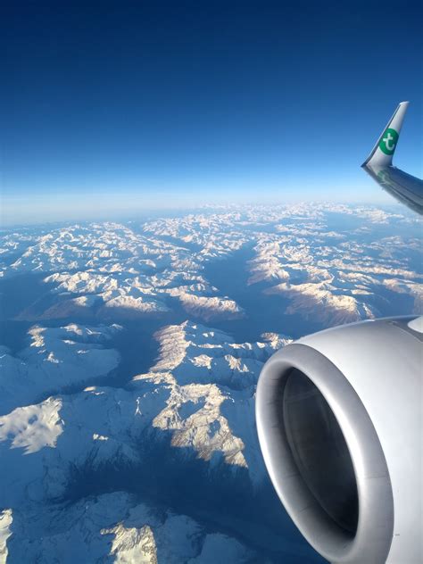 Airplane Flying Above Mountains · Free Stock Photo