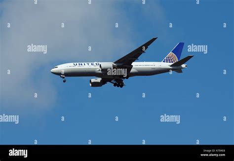 United Airlines Boeing 777 In Flight Over Southwest London On Route To