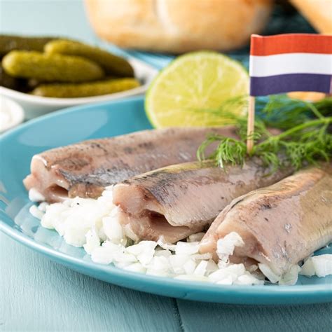 Premium Photo Traditional Dutch Food Freshly Salted Herring Fish With