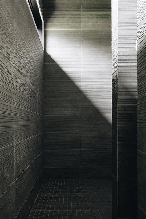 Modern Walk In Shower With Gray Stacked Tiles And Gray Grid Floor