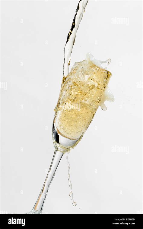 White Wine Splashing Out Of Glass Isolated On White Background Stock