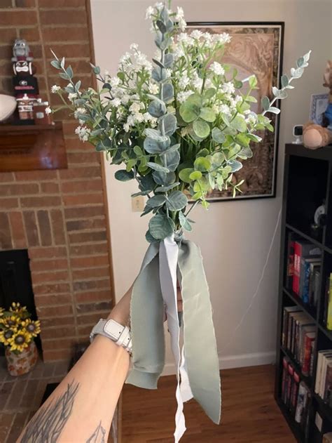 Babys breath and eucalyptus bouquets and boutonnières White wedding