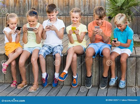 Group of Children Playing with Mobile Phones Outdoors Stock Image - Image of friends, phone ...