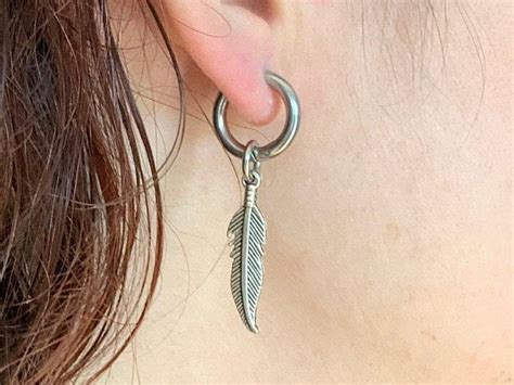 A Single Feather Thick Hoop Earring Also Available As A Pair Of