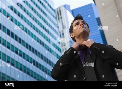 Man Loosening Tie Hi Res Stock Photography And Images Alamy