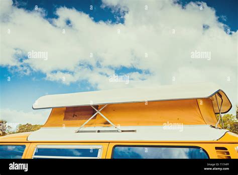 Old Australian Camper Van With Flag Of Australia Behind Its Rear Window