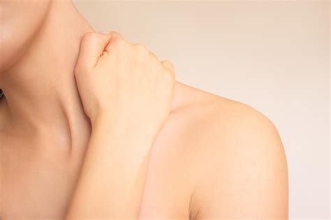 Premium Photo Closeup Shot Of A Naked Woman Who Is Experiencing Neck Pain Holding Her Neck