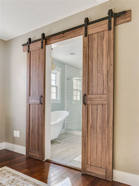 Barn Doors Leading Into Master Bathroom In A Modern Farmhouse Barn Style Sliding Doors