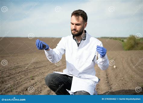 Soil Testing Agronomy Specialist Taking Soil Sample For Fertility