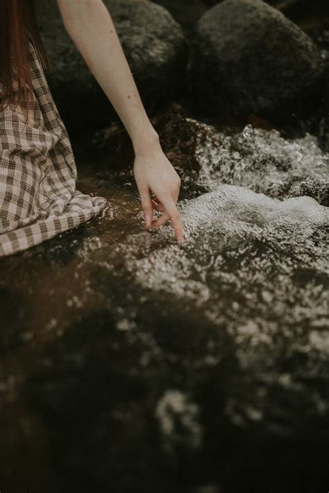 Hand Reaching toward Water · Free Stock Photo