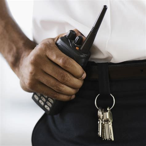 Security guard holding walkie talkie - Victory Baptist Church of ...