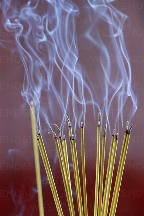 Incense Sticks On Joss Stick Pot Burning Smoke Used To Pay Respect To