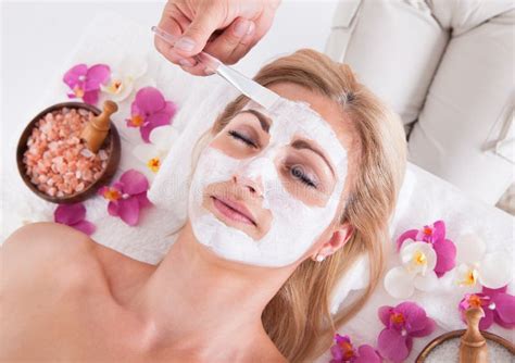 Spa Massage For Woman With Facial Mask On Face Stock Image Image Of