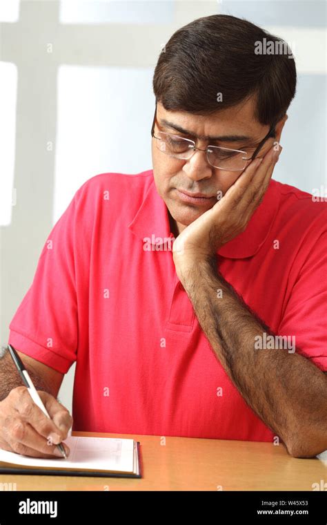 Man Writing In A Diary Stock Photo Alamy