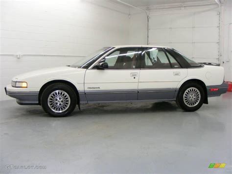 White Oldsmobile Cutlass Supreme Sl Sedan Photo