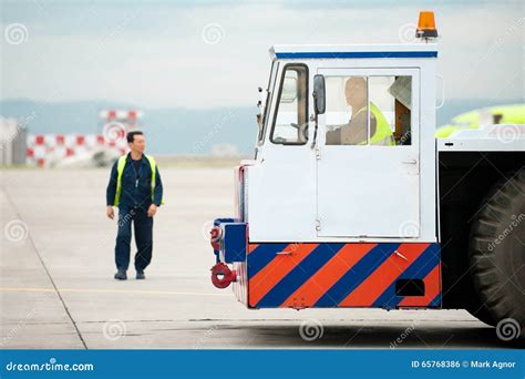 Tug Pushback Tractor In The Airport. Editorial Image | CartoonDealer ...