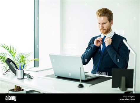 Young man working in the office Stock Photo - Alamy