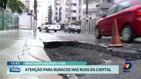 Alerta nas ruas de Florianópolis forte chuva abre enorme buraco no