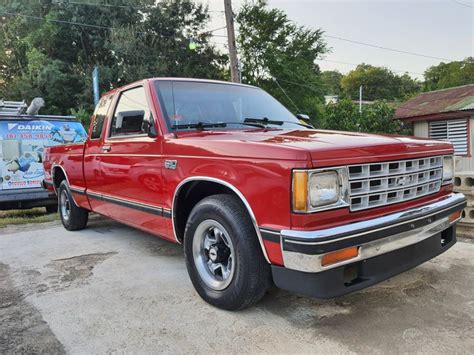 Red Chevy S10 Truck Parked in Front of a House