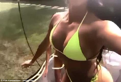 Kim Kardashian Reveals Her Killer Curves In Skimpy Neon Bikini As She